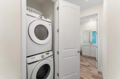 a laundry room with a washer and dryer at Bright And Cozy Villa Near Disney With Margaritaville Resort & Island H2O Access - 3053Cs in Orlando