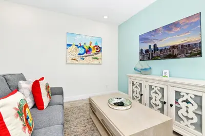 a living room with a couch and a coffee table at Glimmering Blue Villa Near Disney With Margaritaville Resort & Island H20 Waterpark Access - 3016Cs in Orlando