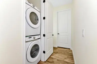 a laundry room with a washer and dryer at Sun Filled Villa Near Disney With Margaritaville Resort & Island H20 Access - 8183Cp in Kissimmee