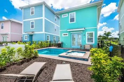 a house with a swimming pool in a yard at Oasis Cottage Near Disney With Margaritaville Resort & Island H20 Waterpark Access - 2936Sr in Orlando