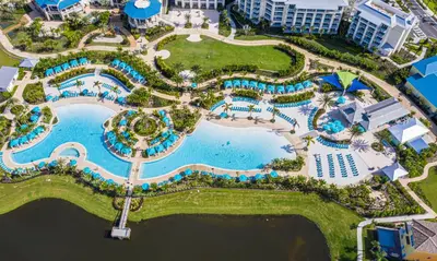 an aerial view of the pool at the resort at Breezy Green Cottage With Private Hot Tub Near Disney With Margaritaville Resort & Island H2O Access - 3055Pi in Orlando