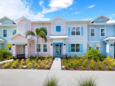 a house with pink and blue at Bright Villa Near Disney With Margaritaville Resort & Island H20 Access - 8159Cp in Orlando