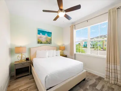 a bedroom with a white bed and a window at Bright Villa Near Disney With Margaritaville Resort & Island H20 Access - 8159Cp in Orlando