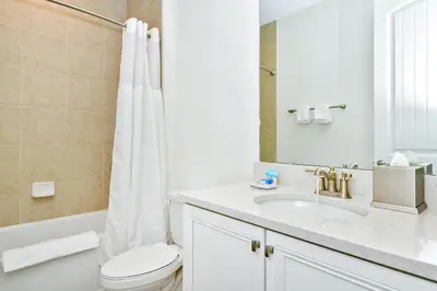 a bathroom with a sink and a toilet and a tub at Relaxed Villa Near Disney With Margaritaville Resort & Island H20 Waterpark Access - 3169Cs in Orlando