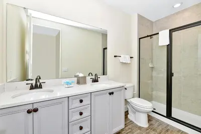 a bathroom with a sink and a toilet and a shower at Tropical Villa Near Disney With Margaritaville Resort & Island H20 Waterpark Access - 3005Cs in Orlando