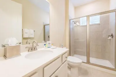 a bathroom with a toilet and a sink and a shower at Blue Sky Cottage Near Disney With Private Hot Tub & Margaritaville Resort & Island H20 Waterpark Access - 3008Sr in Orlando