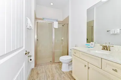 a bathroom with a shower and a toilet and a sink at Cozy Cottage With Private Pool Near Disney With Margaritaville Resort & Island H2O Access - 8028Kd in Orlando