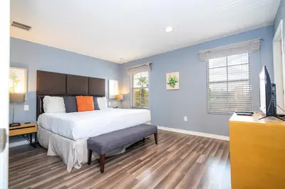 a bedroom with a bed and a television in it at Cozy 2Bd Spa & Jacuzzi Close to Disney at Encantada 3029 in Kissimmee