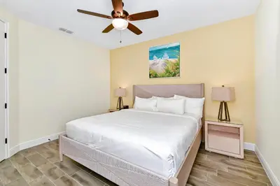 a bedroom with a bed and a ceiling fan at Tangerine Villa Near Disney With Margaritaville Resort & Island H20 Waterpark Access - 2968Cs in Orlando