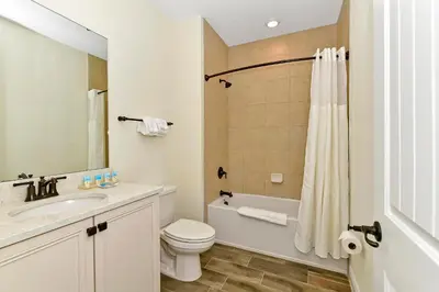 a bathroom with a sink and a toilet and a shower at Tangerine Villa Near Disney With Margaritaville Resort & Island H20 Waterpark Access - 2968Cs in Orlando