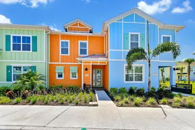a house with an orange and blue at Tangerine Villa Near Disney With Margaritaville Resort & Island H20 Waterpark Access - 2968Cs in Orlando