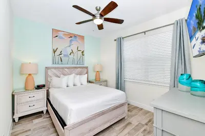 a bedroom with a bed and a ceiling fan at Sunny Villa Near Disney With Margaritaville Resort & Island H20 Access - 8170Cp in Orlando