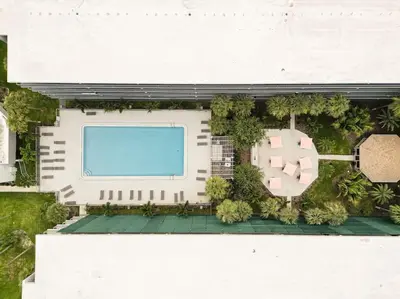 an overhead view of a building with a pool at Spacious 1BR Stay Near Disney parks With pool view in Kissimmee