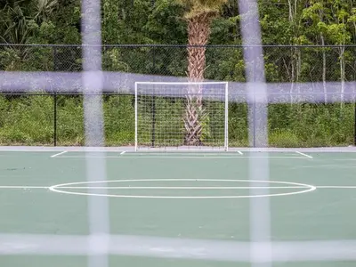 a net on a tennis court with at Relax & Enjoy 1BR Home Near Disney Parks With Lake view in Kissimmee