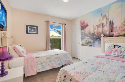 a bedroom with two beds and a castle mural at Relaxing Retreat in the Windsor Palms Resort in Kissimmee