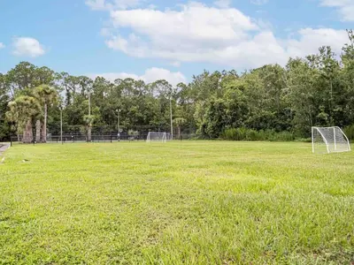 an empty soccer field with a goal at Delightful 1BR Condo Next to Disney With Lake view in Vineland