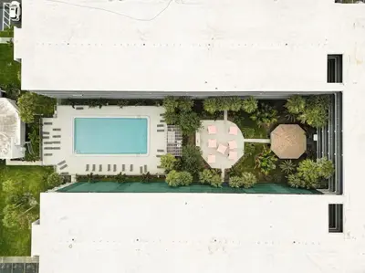 an overhead view of a building with a pool at Lovely 1BR Suite Minutes to Disney With Lake view in Vineland