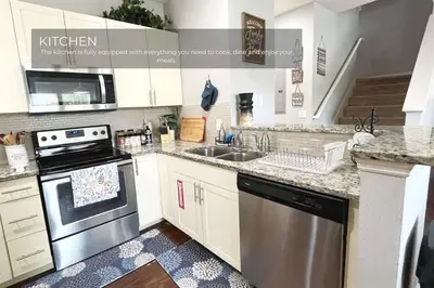 a kitchen with a sink and a stove top oven at Spacious 4-Bedroom Family Retreat Near Disneyland! in Kissimmee