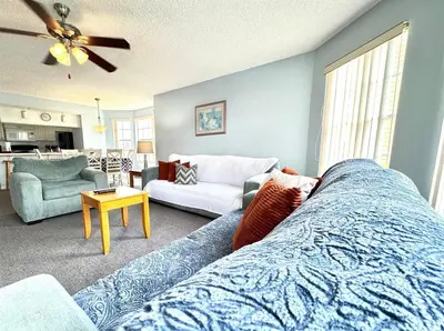 a living room with a bed and a couch at 2492 Your home away from Home in Kissimmee