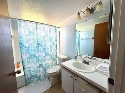 a bathroom with a sink and a toilet and a shower at 2492 Your home away from Home in Kissimmee