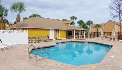 a swimming pool in front of a house at 2492 Your home away from Home in Kissimmee
