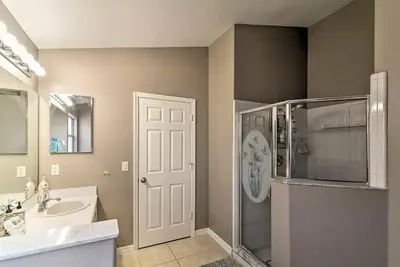 a bathroom with a sink and a shower and a mirror at 4 Bed Villa in Kissimmee, Orlando in Kissimmee