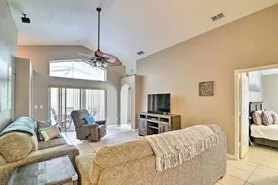 a living room with a couch and a tv at 4 Bed Villa in Kissimmee, Orlando in Kissimmee