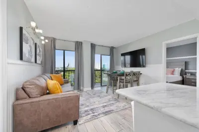 a kitchen and living room with a couch and a table at Apartment in Florida near Universal and Intern. Dr in Orlando