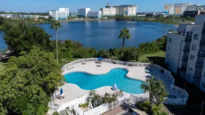 an overhead view of a swimming pool with a large lake at Apartment in Florida near Universal and Intern. Dr in Orlando