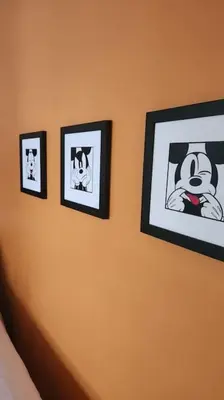 four pictures on a wall in a bedroom at Fantasy Villas resort - Waterpark Included - Family Paradise! minutes to Disney in Kissimmee