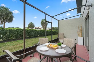 a patio with a table with a basket of fruit at Fantasy Villas resort - Waterpark Included - Family Paradise! minutes to Disney in Kissimmee
