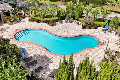 an overhead view of a swimming pool in a backyard at Entire home w/ Private Pool,Gated Near Disney in Orlando