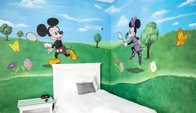 a bedroom with a mural of mickey mouse on the wall at Casa c/ Piscina, Sala de Jogos e 6 Suítes in Orlando