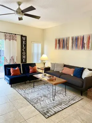 a living room with a couch and a coffee table at Ideal 3 BR Resort Villa with Laundry in Kissimmee