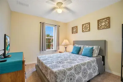 a bedroom with a bed and a window at Ideal 3 BR Resort Villa with Laundry in Kissimmee