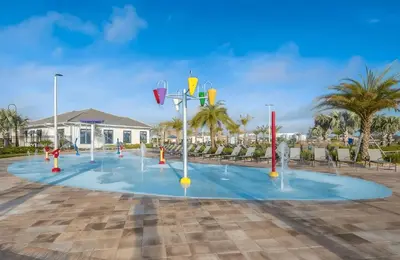 a basketball court in a parking lot with palm trees at Casa de Luxo em Storey Lake Resort in Kissimmee