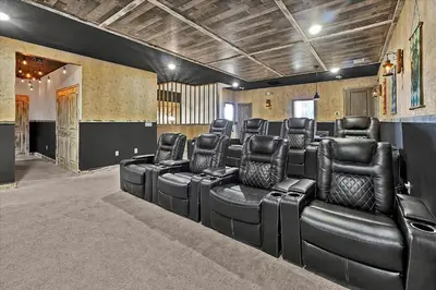 a conference room with black leather chairs in it at Gorgeous Paradiso Mansion-Poolgame Roomtheater-3 in Orlando