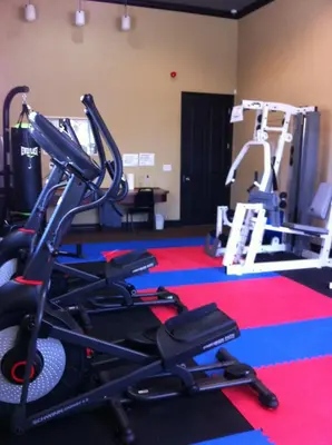 a gym with several treadmills and a treadmill at Four Bedroom Villa in Coral Cay in Kissimmee