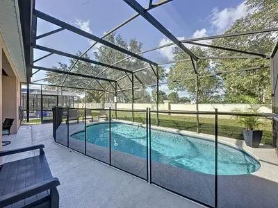 a swimming pool inside of a house at 4 Bed in Windsor Palms Resort - Steps to Disney villa in Kissimmee