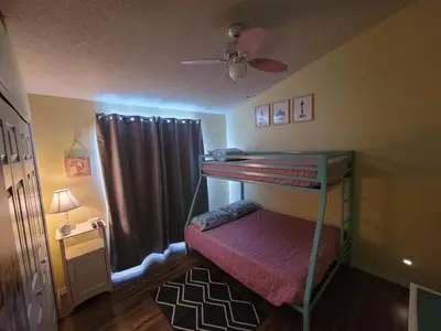 a bedroom with a bunk bed and a ceiling fan at 8056 Indian Creek Blvd in Kissimmee