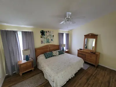 a bedroom with a bed and a ceiling fan at 8056 Indian Creek Blvd in Kissimmee