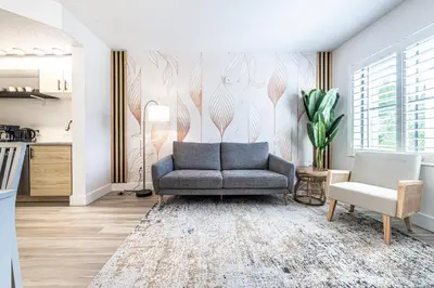 a living room with a couch and a chair at Apartment - near Epic Universe and Universal, free parking in Orlando
