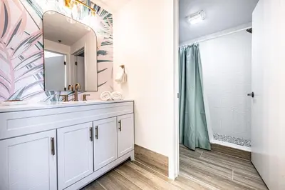 a bathroom with a sink and a shower at One bedroom unit near Epic Universe and Universal, free parking in Orlando