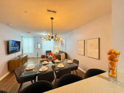 a dining room and living room with a dining table at P42 New Townhouse at Vista Cay Walking distance to CCCO in Orlando