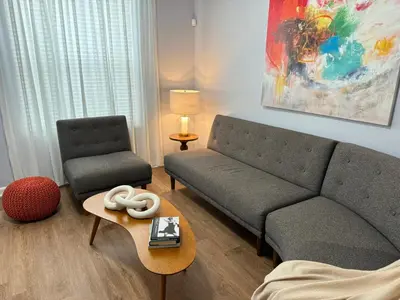 a living room with a couch and a table at P42 New Townhouse at Vista Cay Walking distance to CCCO in Orlando