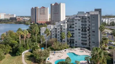 an aerial view of a building with a swimming pool at 6165 Carrier Drive 1001 in Orlando