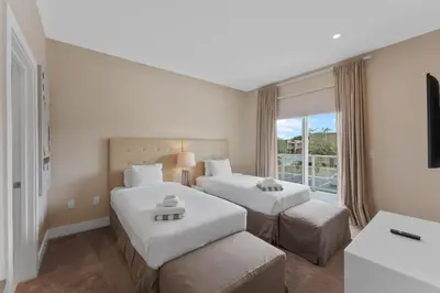a hotel room with two beds and a window at Luxury 4BR Townhouse Next to Disney Orlando 3201 in Orlando