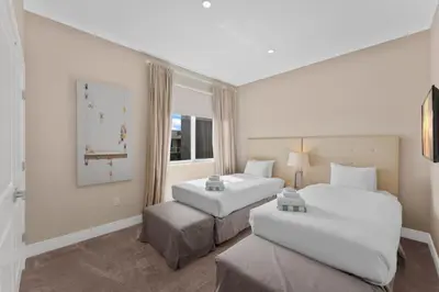 a hotel room with two beds and a window at Luxury 4BR Townhouse Next to Disney Orlando 3201 in Orlando