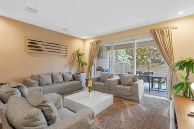 a living room with a couch and a table at Luxury 4BR Townhouse Next to Disney Orlando 3175 in Orlando