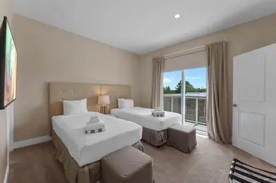 a hotel room with two beds and a window at Luxury 4BR Townhouse Next to Disney Orlando 3175 in Orlando